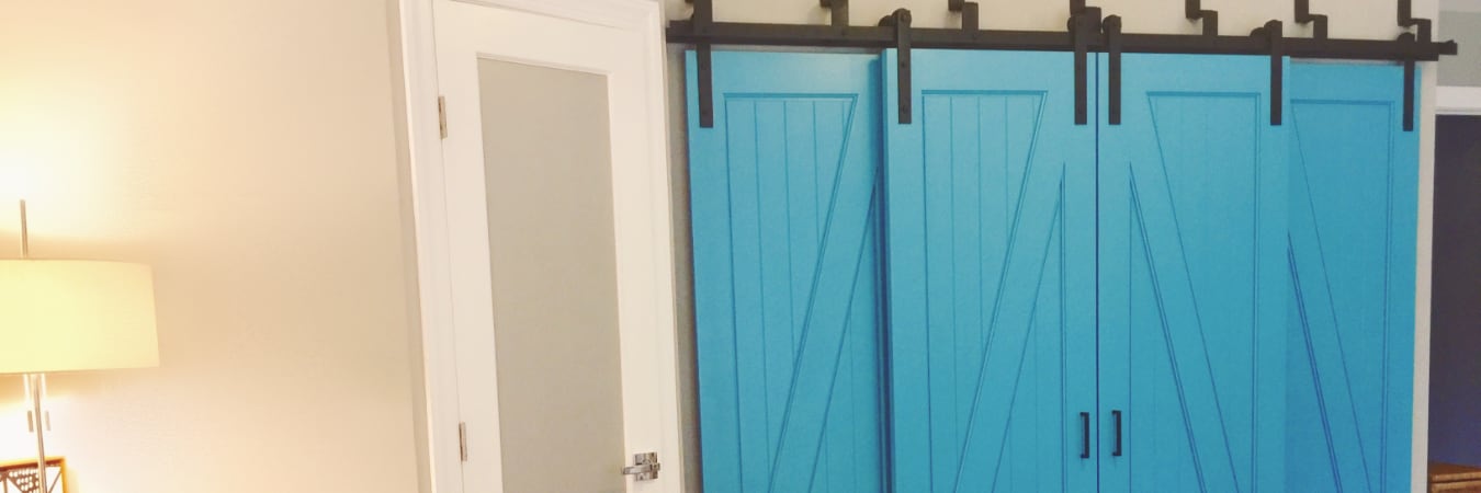 Sunburst barn doors in a bedroom